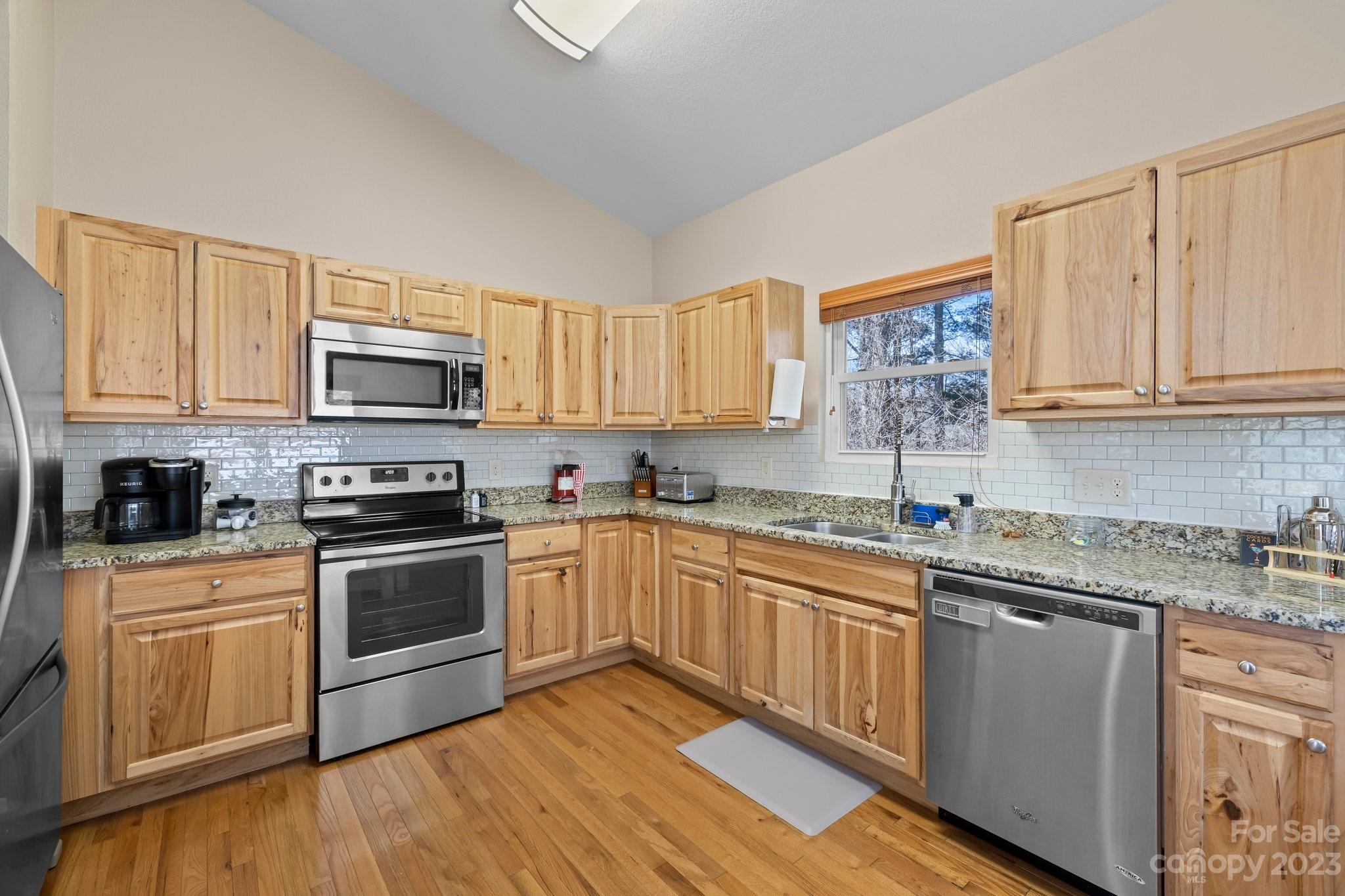 174 Diamond Point Canton, NC 28716 - Photo 15 of 43 a kitchen with stainless steel appliances granite countertop a sink and cabinets