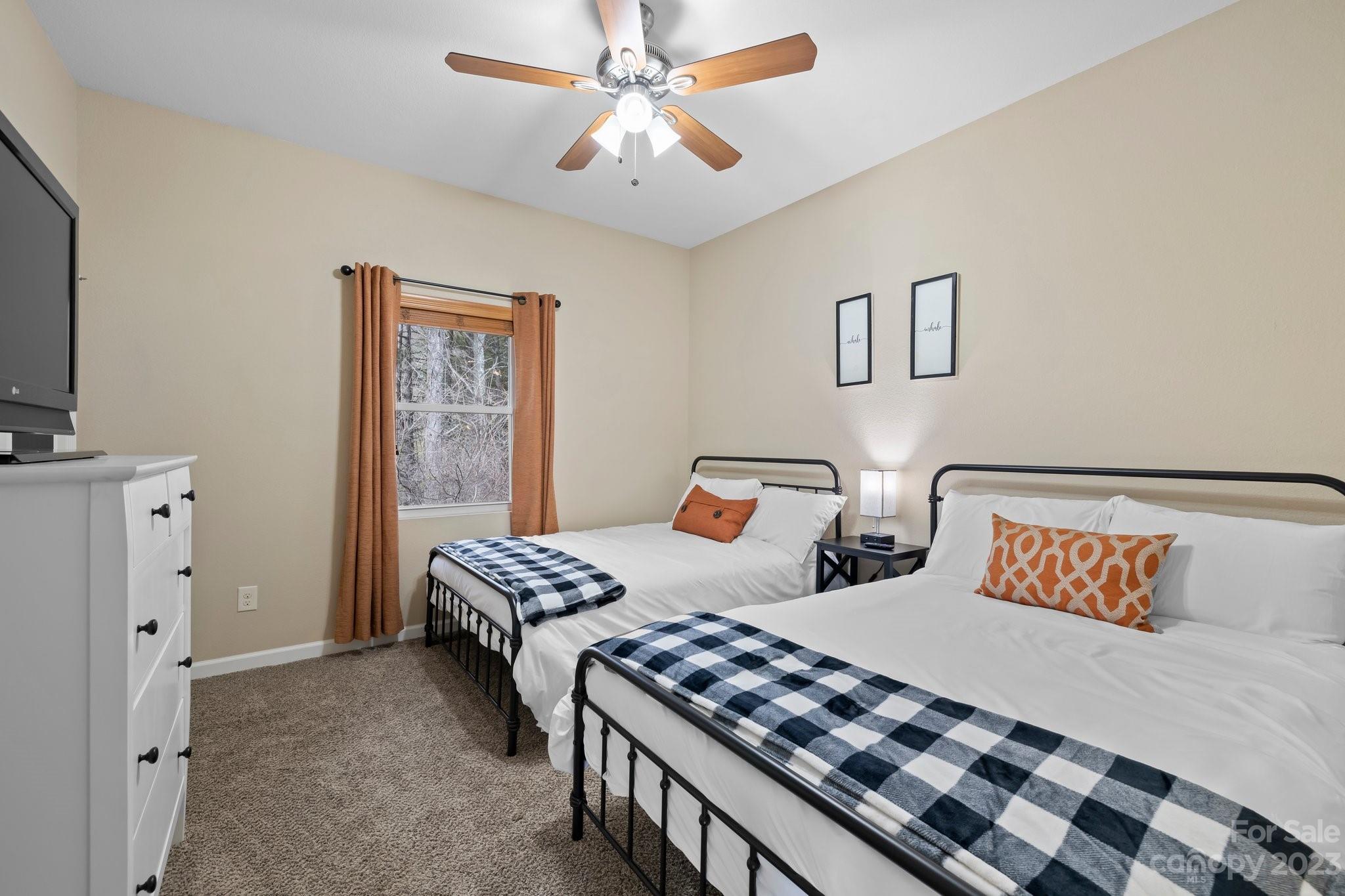 174 Diamond Point Canton, NC 28716 - Photo 18 of 43 a bedroom with two beds and a chandelier