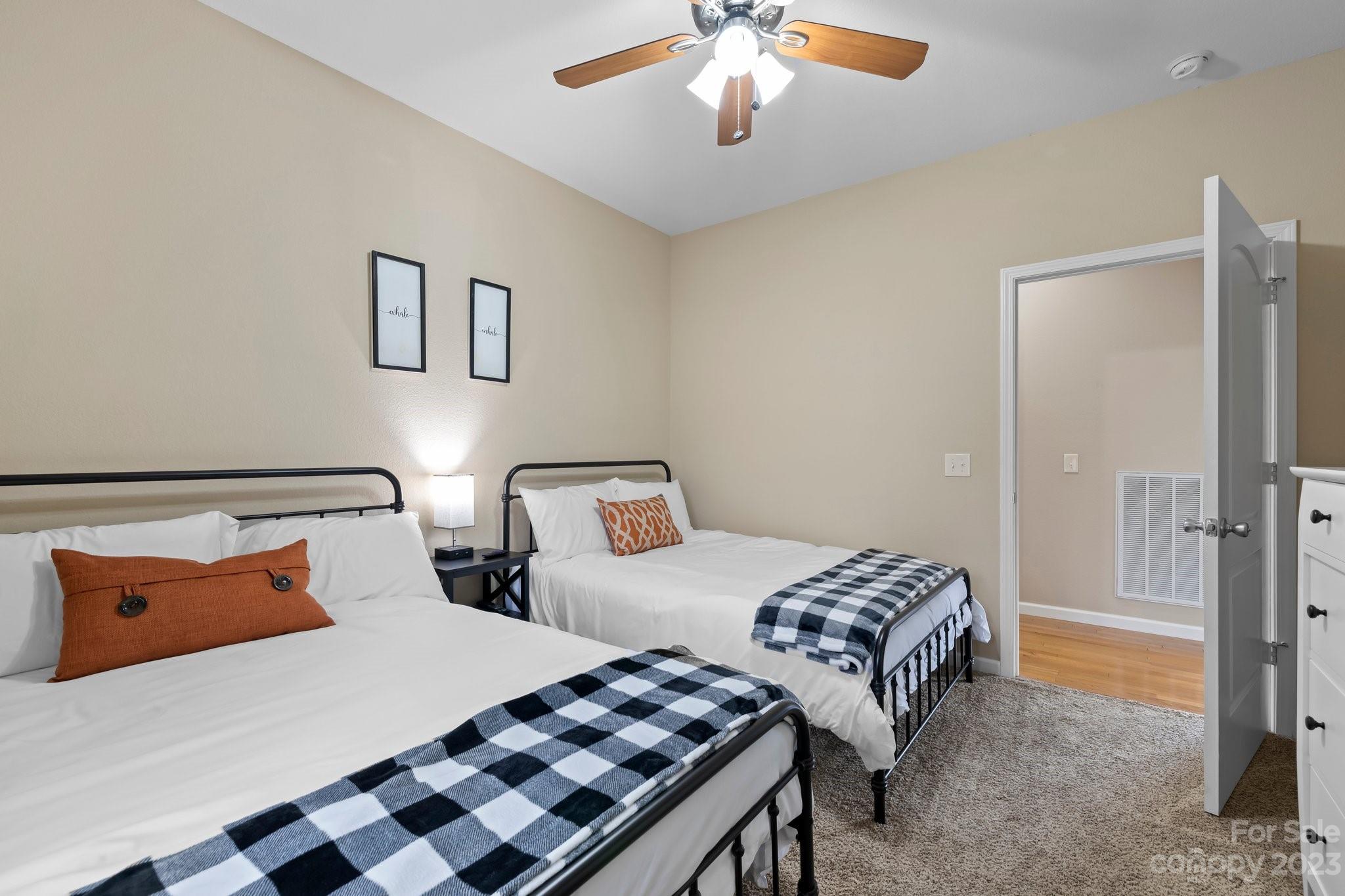 174 Diamond Point Canton, NC 28716 - Photo 19 of 43 a bedroom with two beds and a chandelier