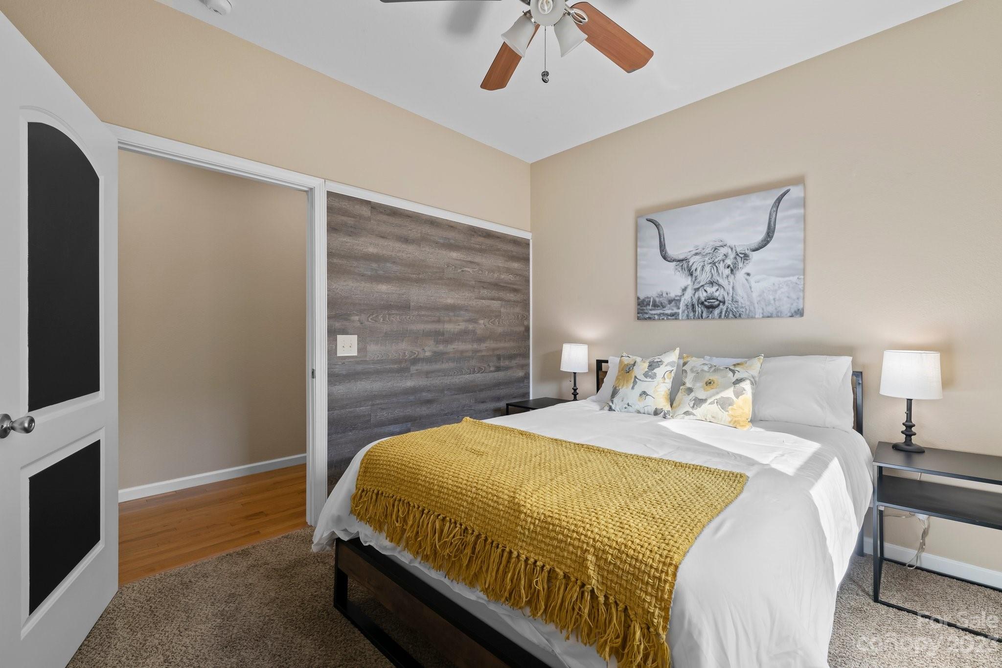 174 Diamond Point Canton, NC 28716 - Photo 21 of 43 a bedroom with a bed and a flat screen tv