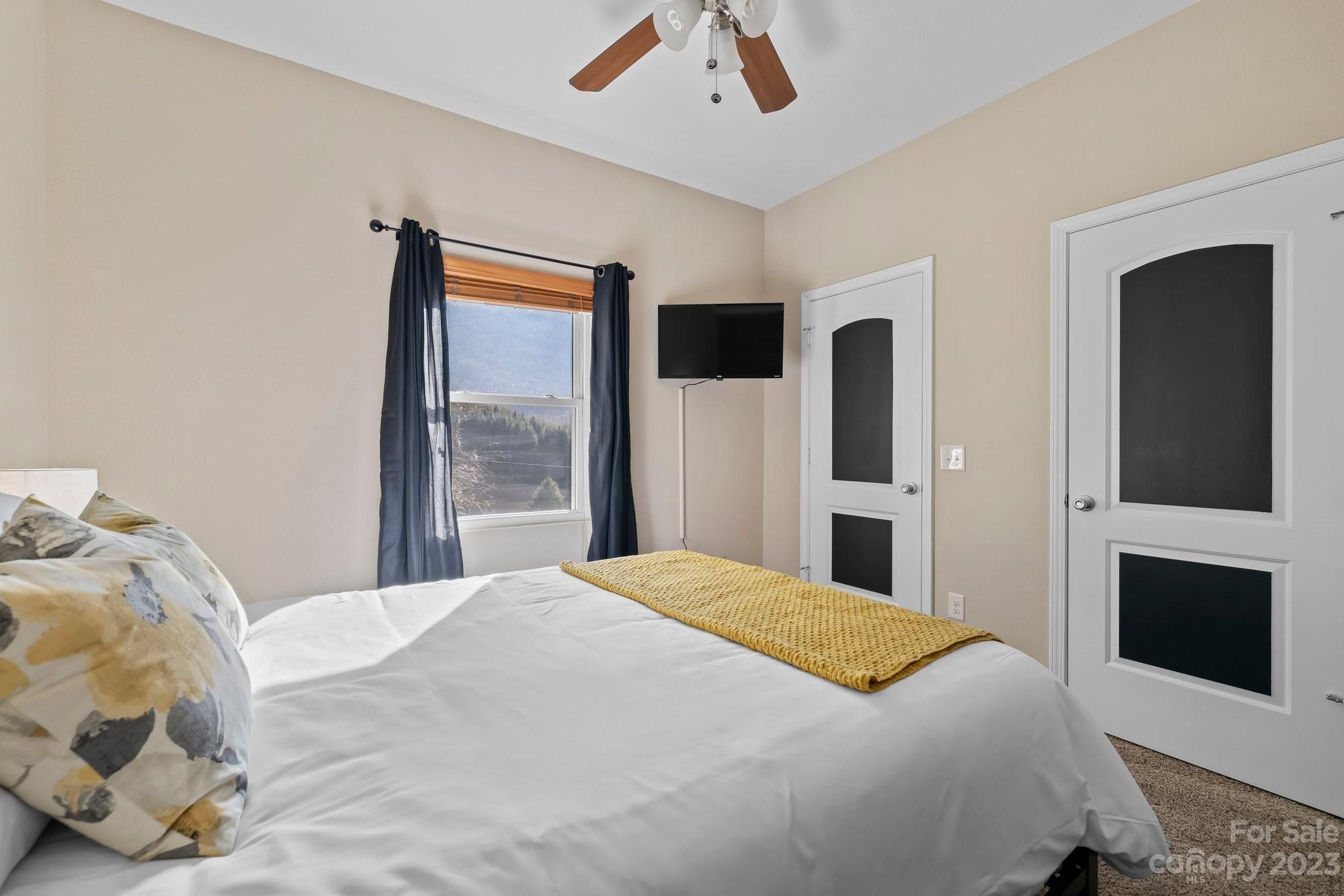 174 Diamond Point Canton, NC 28716 - Photo 23 of 43 a bedroom with bed and window