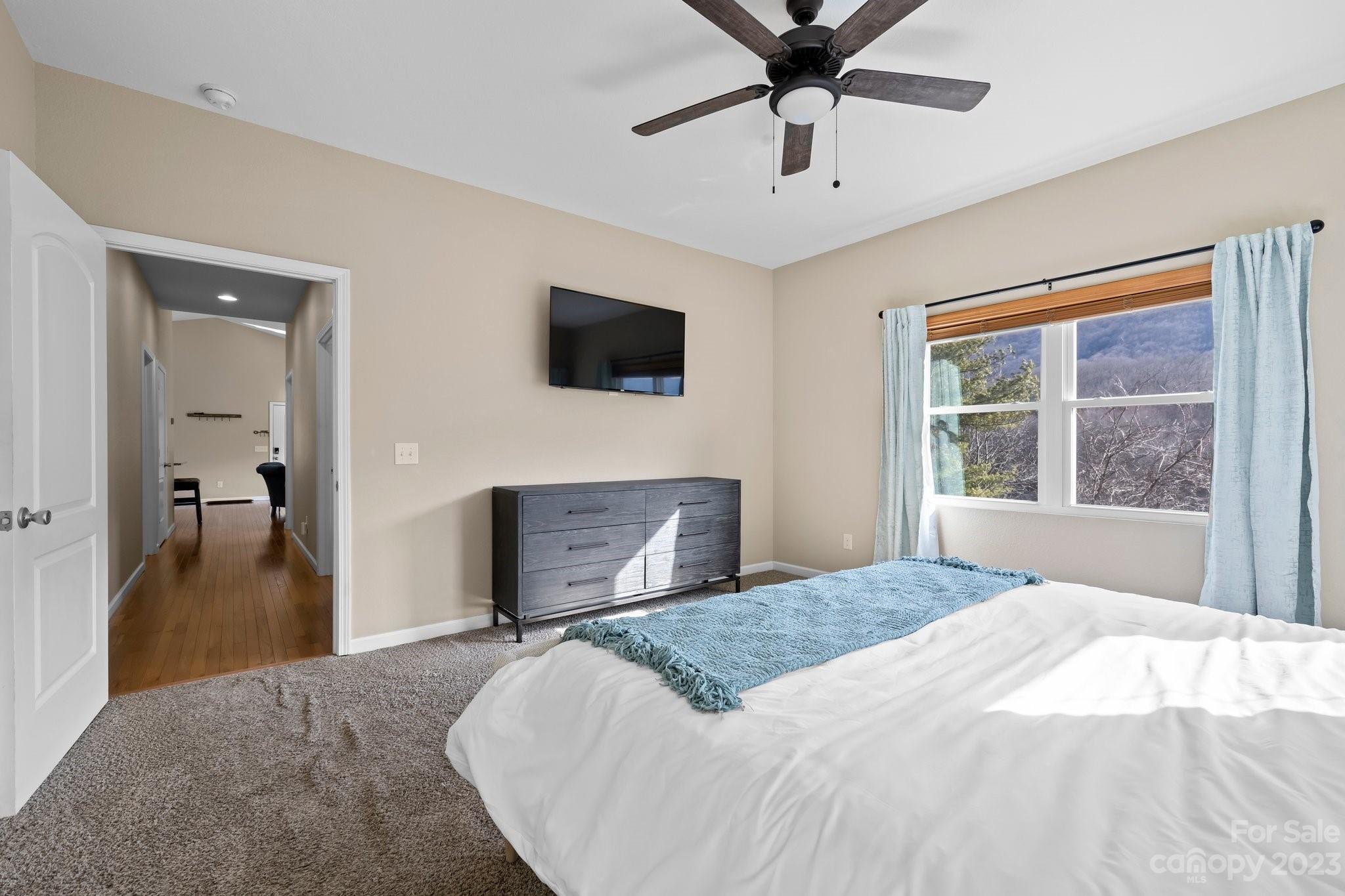 174 Diamond Point Canton, NC 28716 - Photo 25 of 43 a bedroom with a bed and a flat screen tv