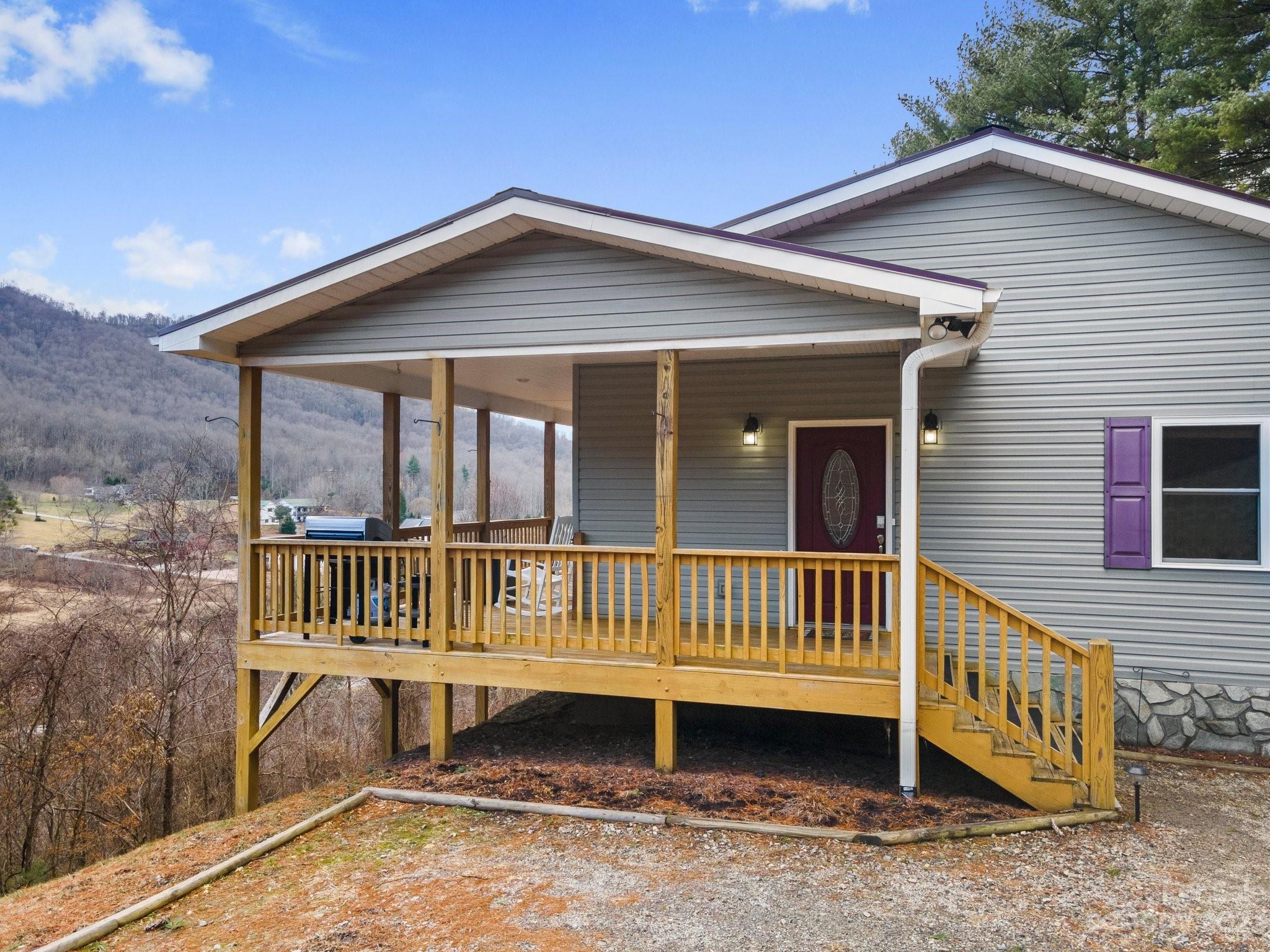 174 Diamond Point Canton, NC 28716 - Photo 3 of 43 a view of a house with a wooden deck