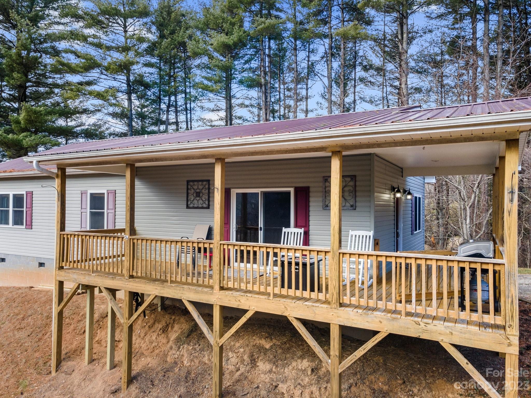 174 Diamond Point Canton, NC 28716 - Photo 31 of 43 a view of a house with wooden deck and furniture