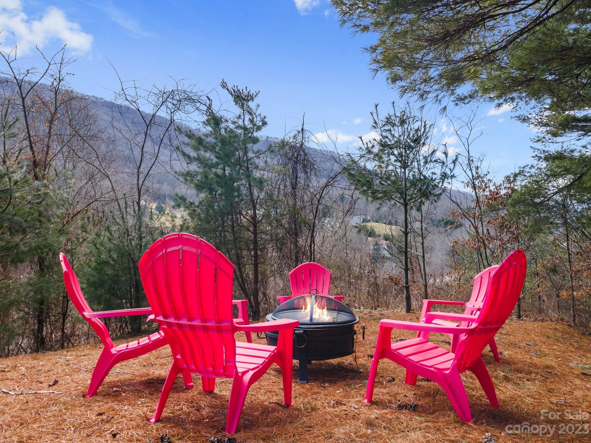 174 Diamond Point Canton, NC 28716 - Photo 39 of 43 a patio with tables and chairs under an umbrella