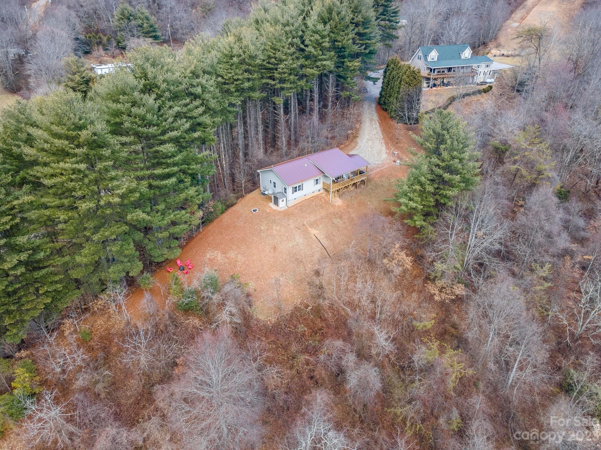 174 Diamond Point Canton, NC 28716 - Photo 40 of 43 a view of a yard with plants and wooden fence