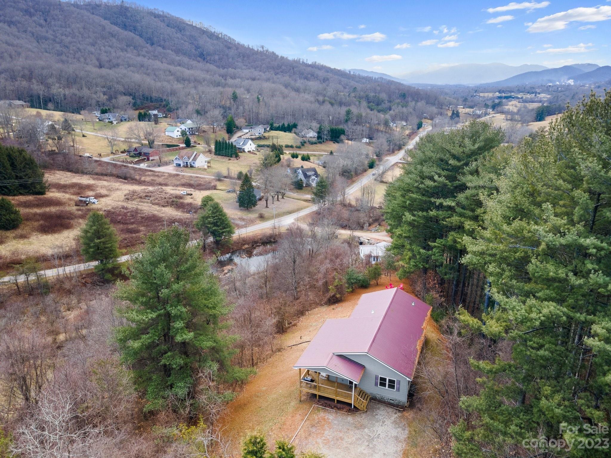 174 Diamond Point Canton, NC 28716 - Photo 42 of 43 an aerial view of a house with a yard and lake view