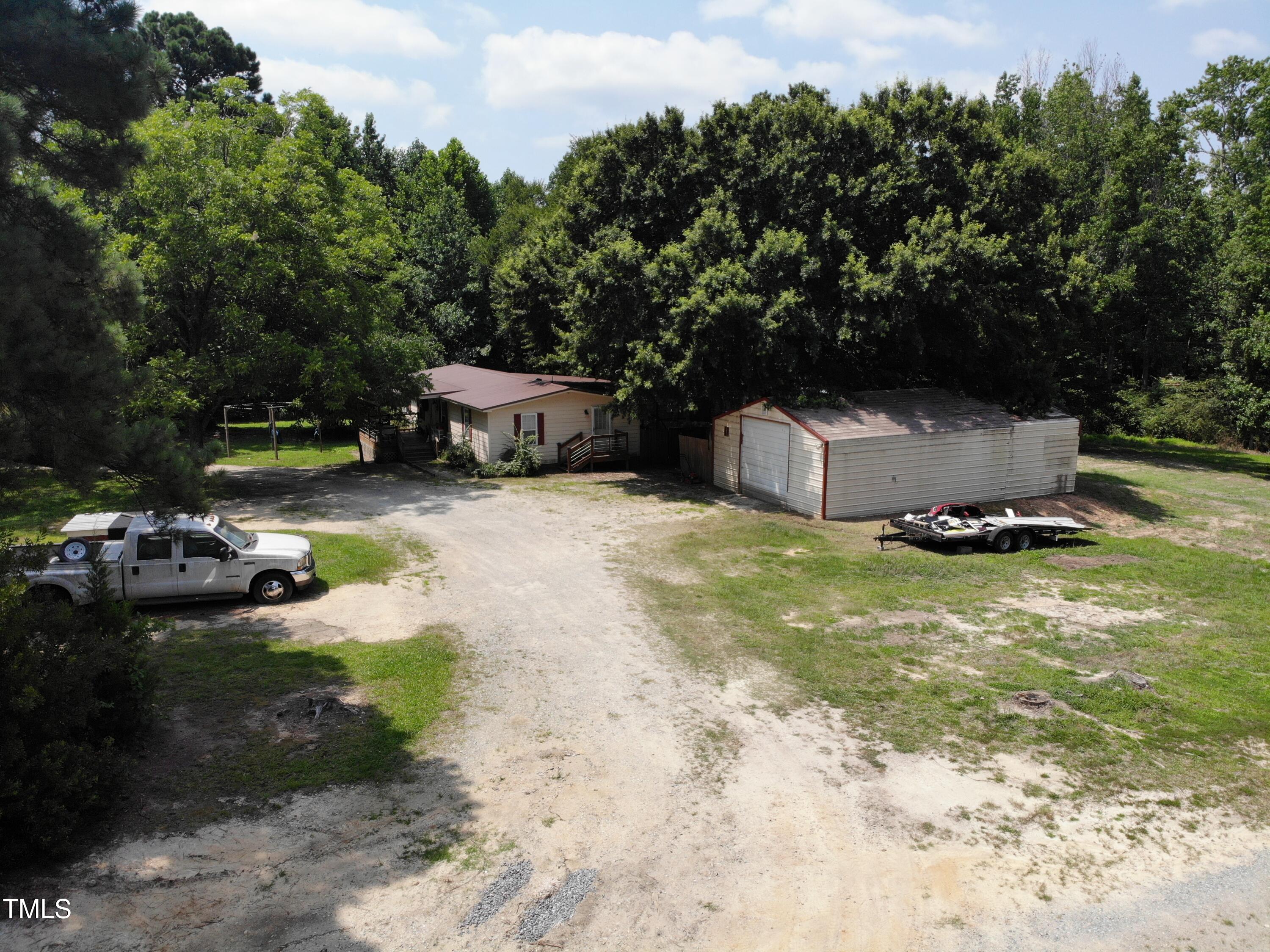 3204 Friendship Road Apex, NC 27502 - Photo 6 of 10 a backyard of a house with table and chairs