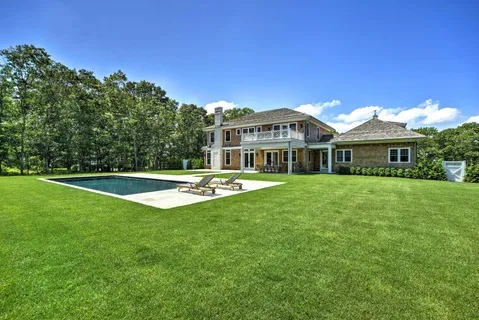 a view of a house with a swimming pool