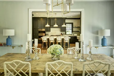 a kitchen with a table and chairs in it
