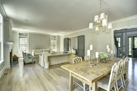 a view of a dining room with furniture wooden floor and chandelier