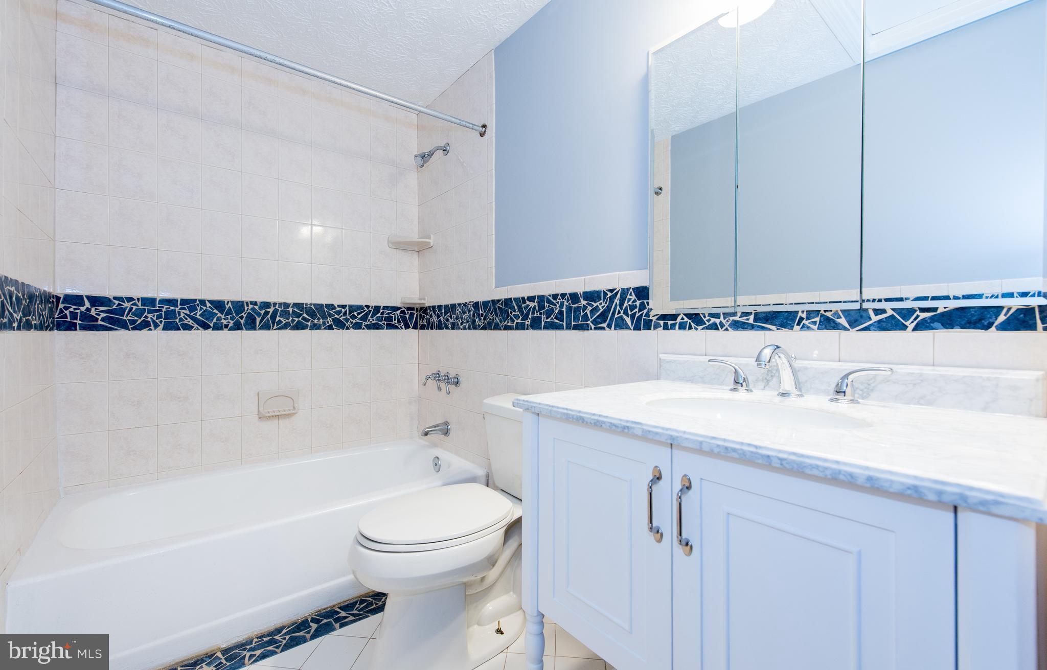 35 Hyacinth Road Baltimore, MD 21234 - Photo 11 of 23 a bathroom with a sink a toilet and shower