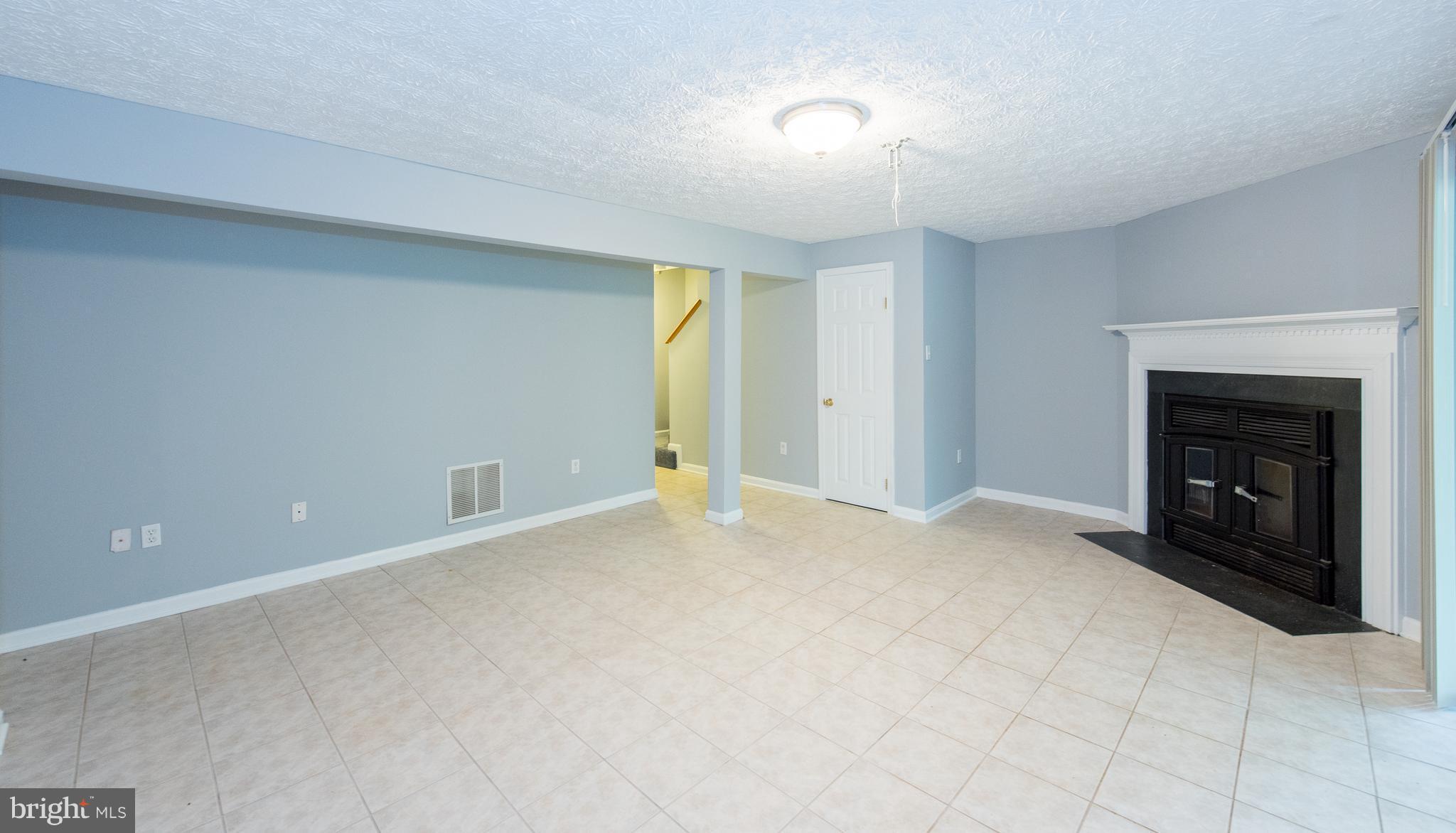 35 Hyacinth Road Baltimore, MD 21234 - Photo 17 of 23 a view of an empty room with a fireplace