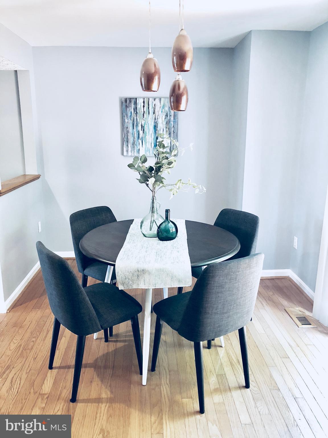 35 Hyacinth Road Baltimore, MD 21234 - Photo 6 of 23 a dining room with furniture and wooden floor