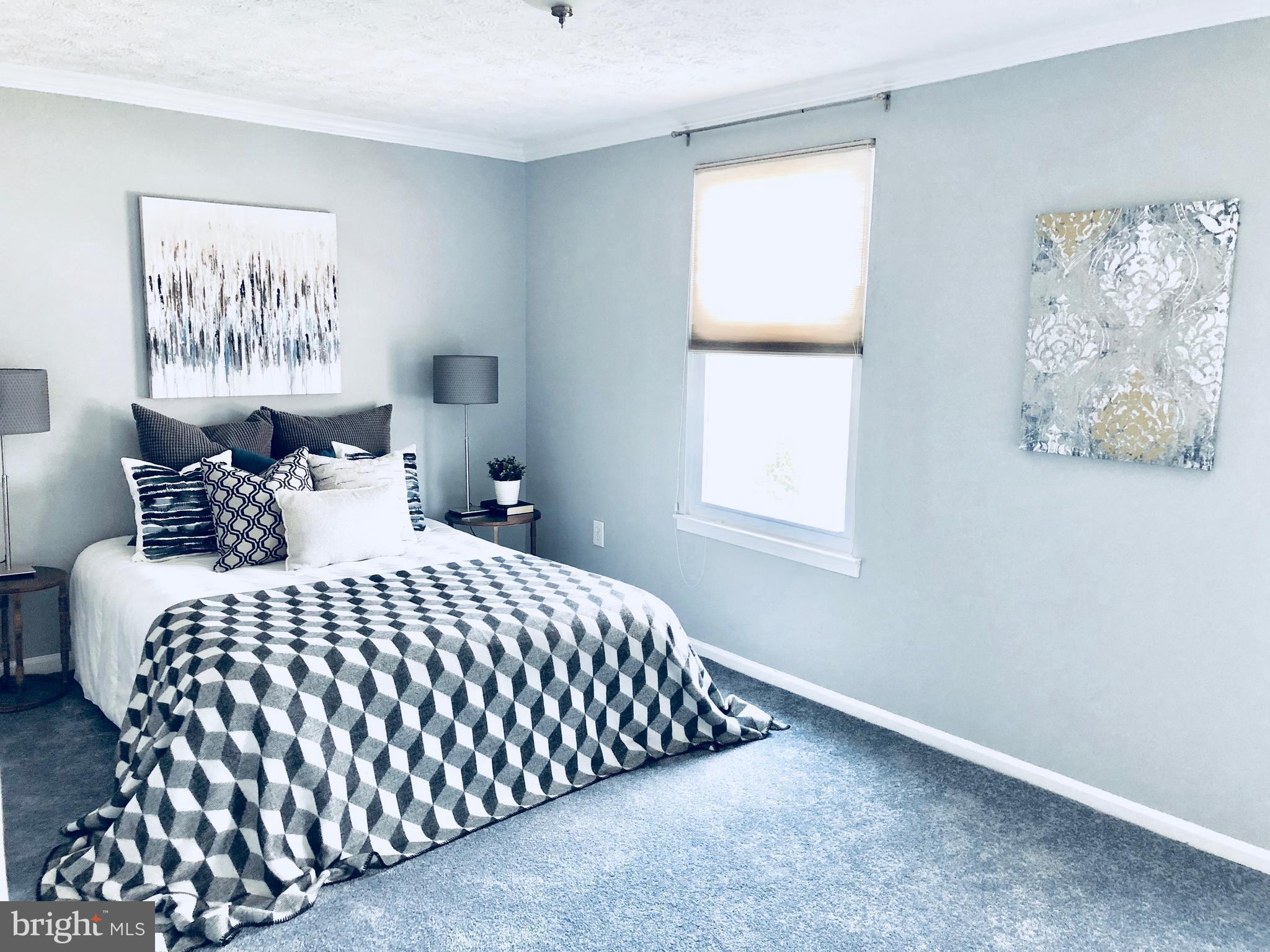 35 Hyacinth Road Baltimore, MD 21234 - Photo 7 of 23 a bedroom with a bed and painting on the wall