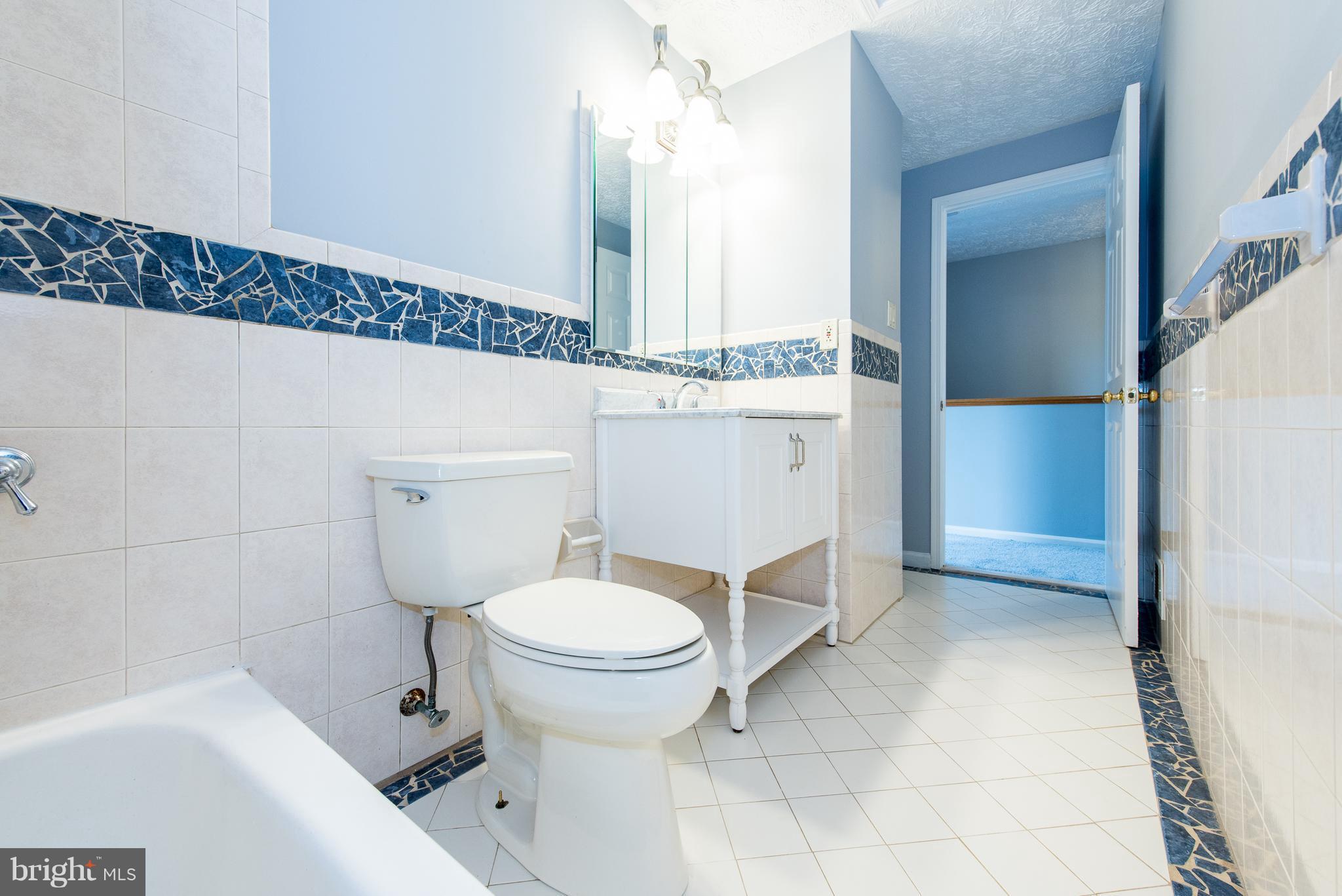 35 Hyacinth Road Baltimore, MD 21234 - Photo 10 of 23 a bathroom with a sink a toilet and shower