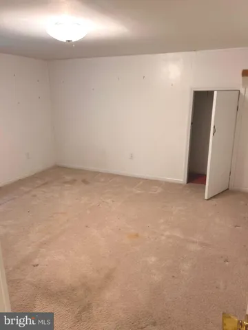 an empty room with a projector