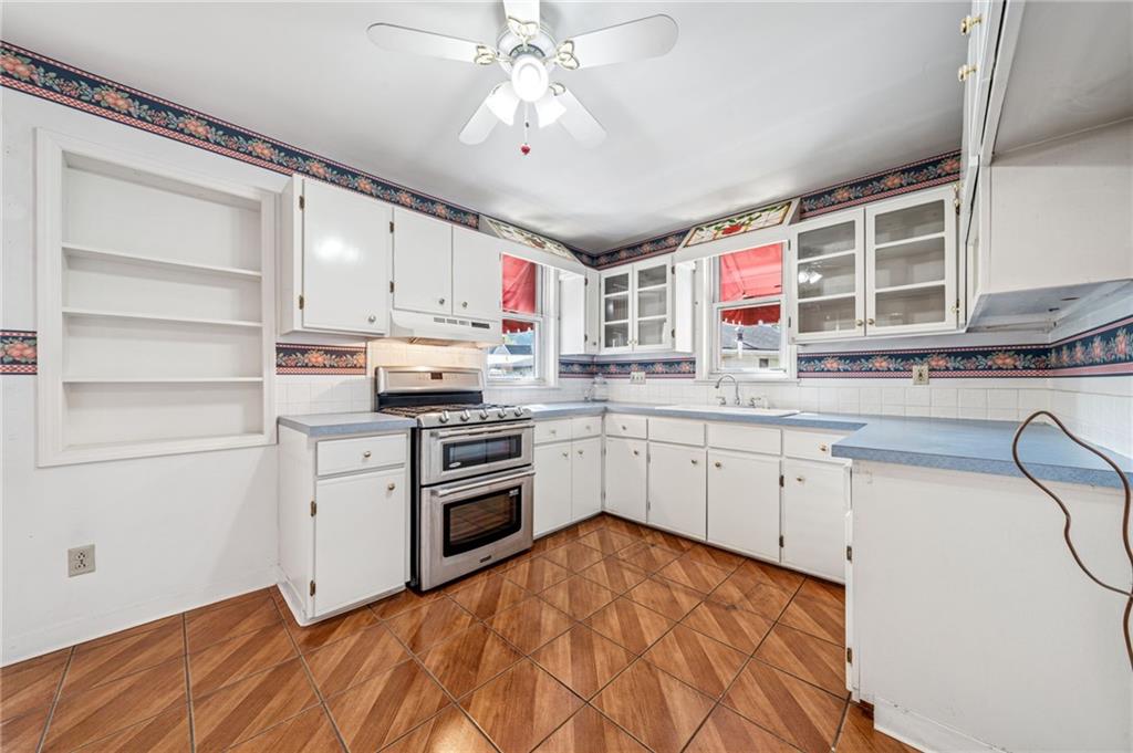 100 Grace Street Apollo, PA 15613 - Photo 18 of 42 a kitchen with stainless steel appliances granite countertop a stove a sink and a refrigerator