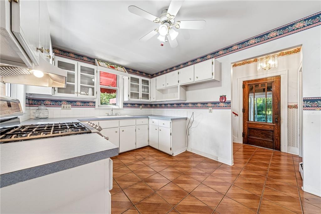 100 Grace Street Apollo, PA 15613 - Photo 20 of 42 a kitchen with stainless steel appliances granite countertop a sink stove and refrigerator