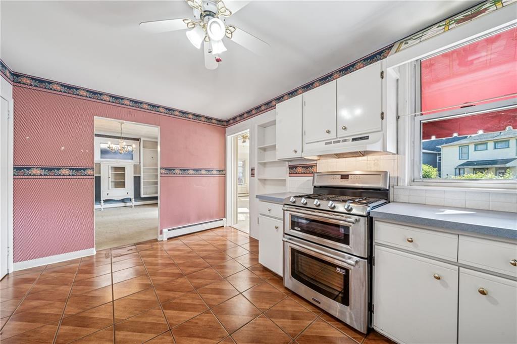 100 Grace Street Apollo, PA 15613 - Photo 21 of 42 a kitchen with stainless steel appliances granite countertop a stove top oven a sink dishwasher and a refrigerator with wooden floor