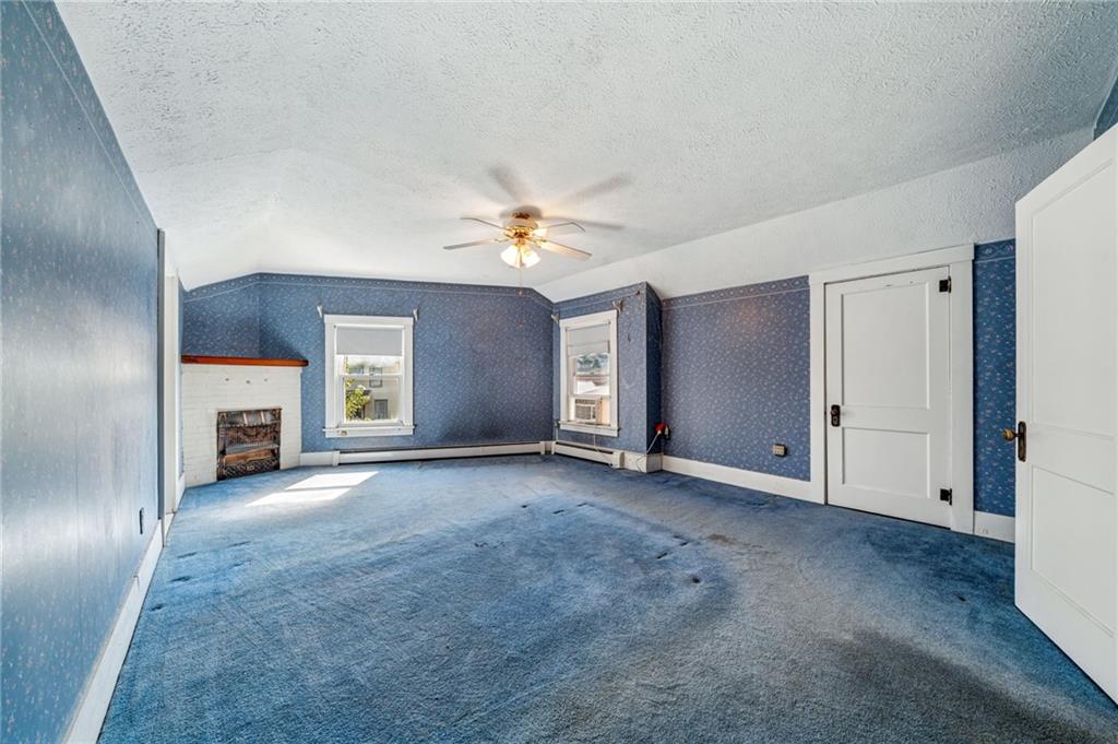 100 Grace Street Apollo, PA 15613 - Photo 30 of 42 an empty room with windows and fireplace