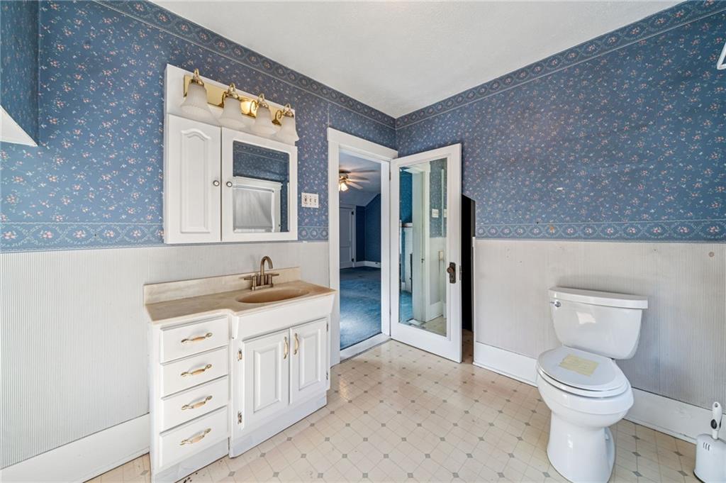 100 Grace Street Apollo, PA 15613 - Photo 31 of 42 a bathroom with a granite countertop toilet sink and mirror