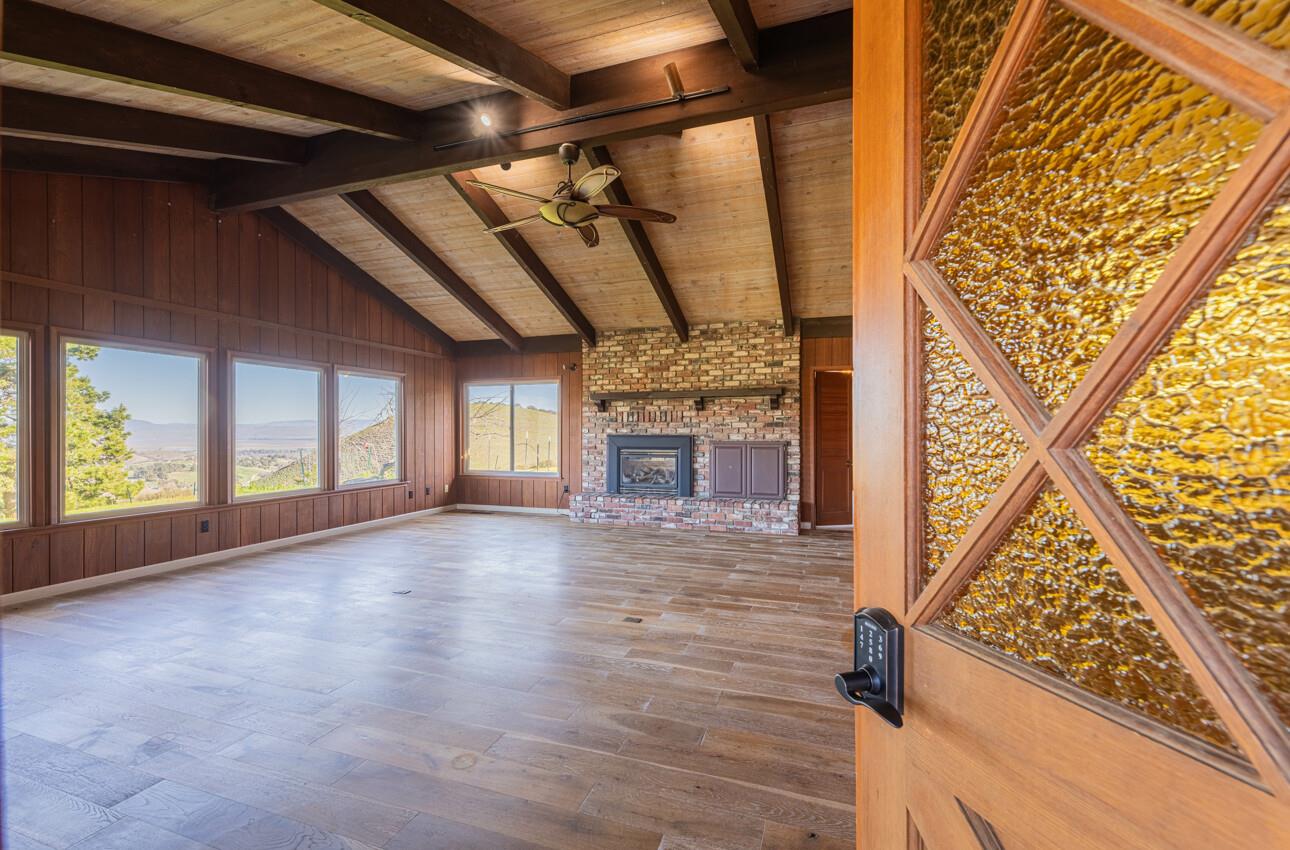 52259 Pine Canyon Road King City, CA 93930 - Photo 14 of 62 a view of an empty room with wooden floor and a window