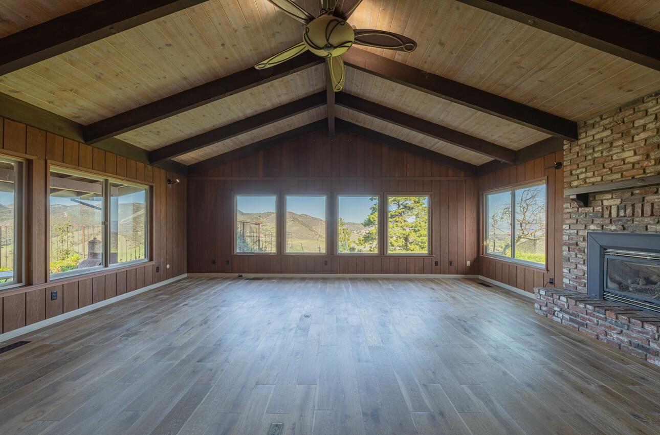 52259 Pine Canyon Road King City, CA 93930 - Photo 16 of 62 a view of a livingroom with wooden floor and a fireplace