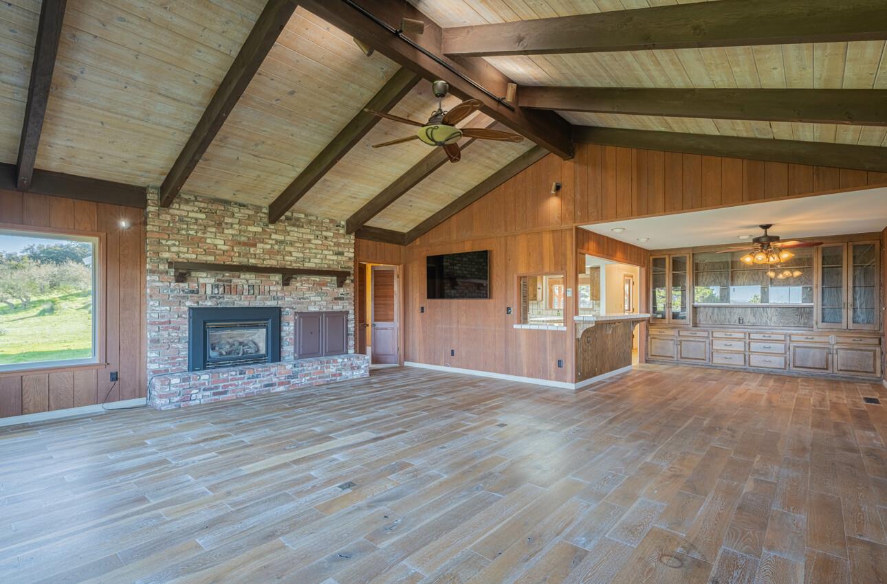 52259 Pine Canyon Road King City, CA 93930 - Photo 18 of 62 a view of empty room with wooden floor and fireplace