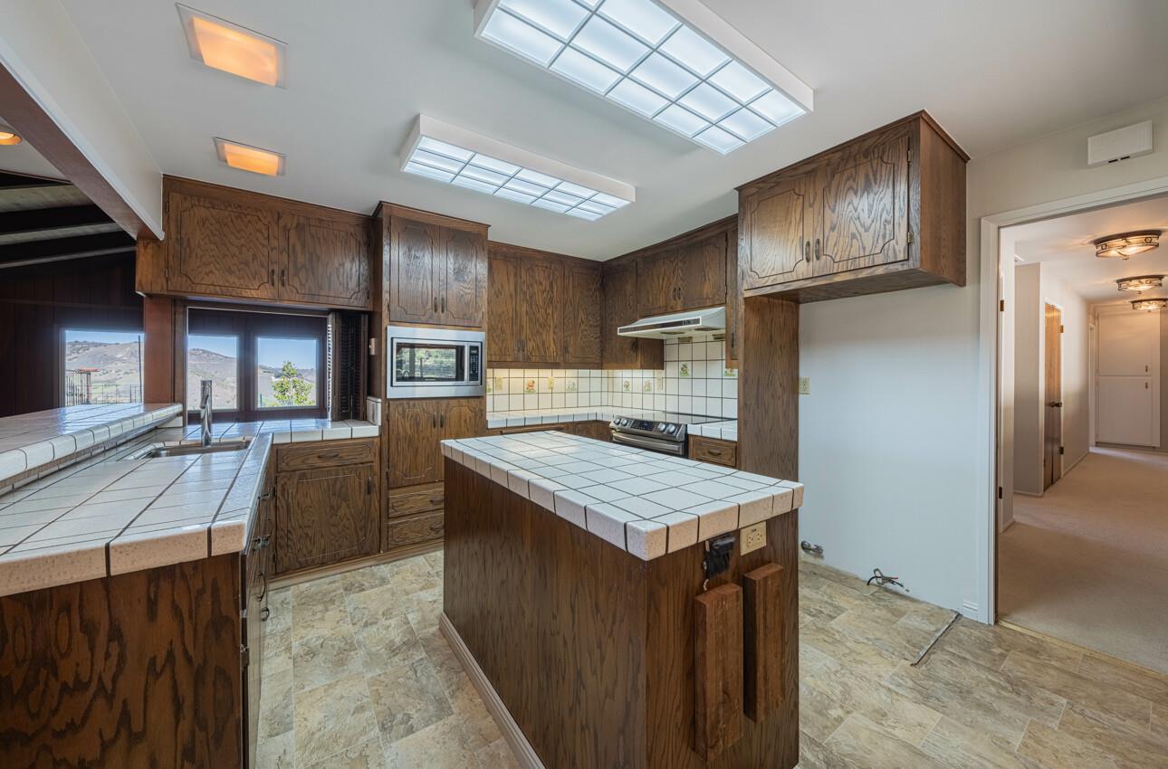 52259 Pine Canyon Road King City, CA 93930 - Photo 21 of 62 a living room with stainless steel appliances kitchen island granite countertop furniture and a kitchen view