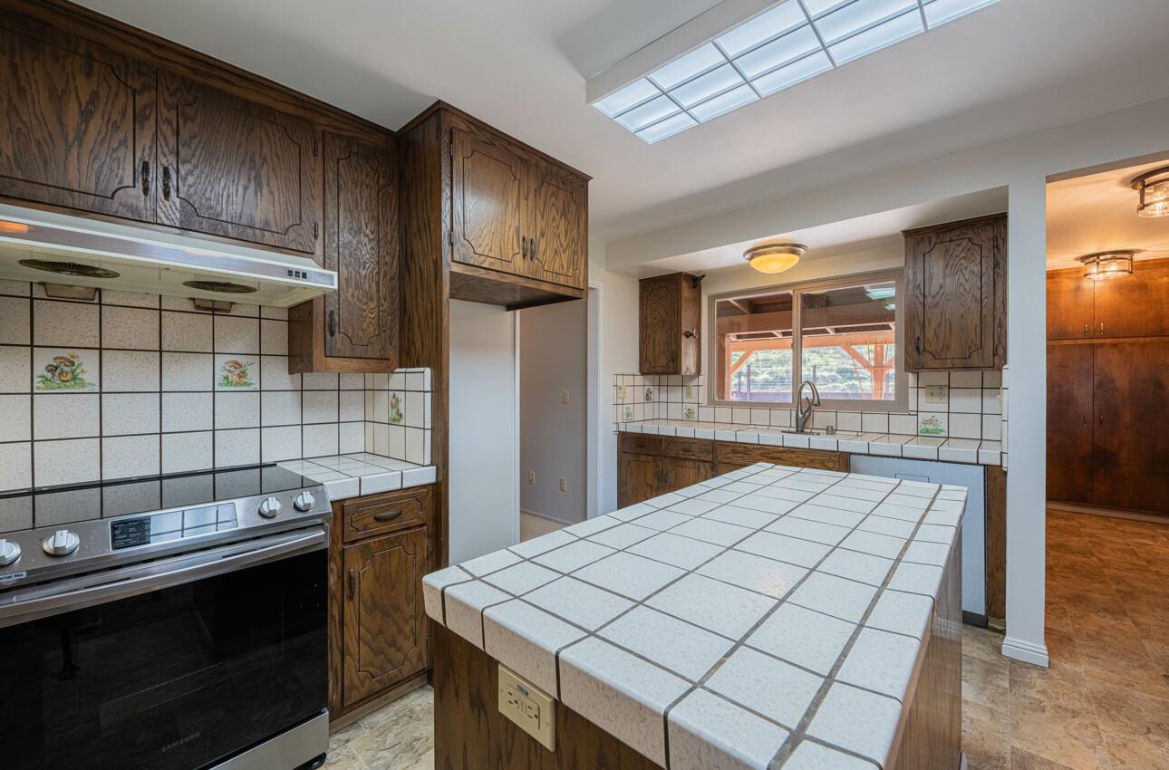 52259 Pine Canyon Road King City, CA 93930 - Photo 23 of 62 a kitchen with a sink and cabinets
