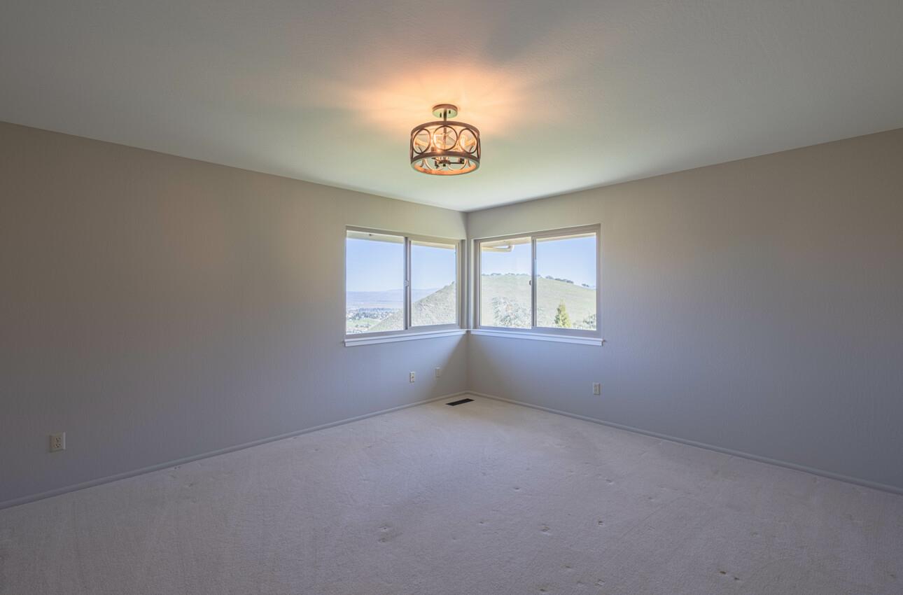 52259 Pine Canyon Road King City, CA 93930 - Photo 28 of 62 an empty room with windows and couch