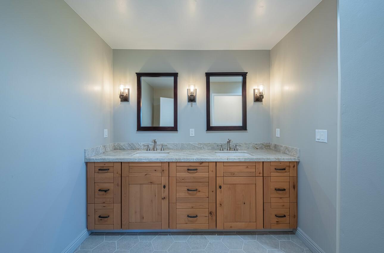 52259 Pine Canyon Road King City, CA 93930 - Photo 32 of 62 a bathroom with double sink and a mirror