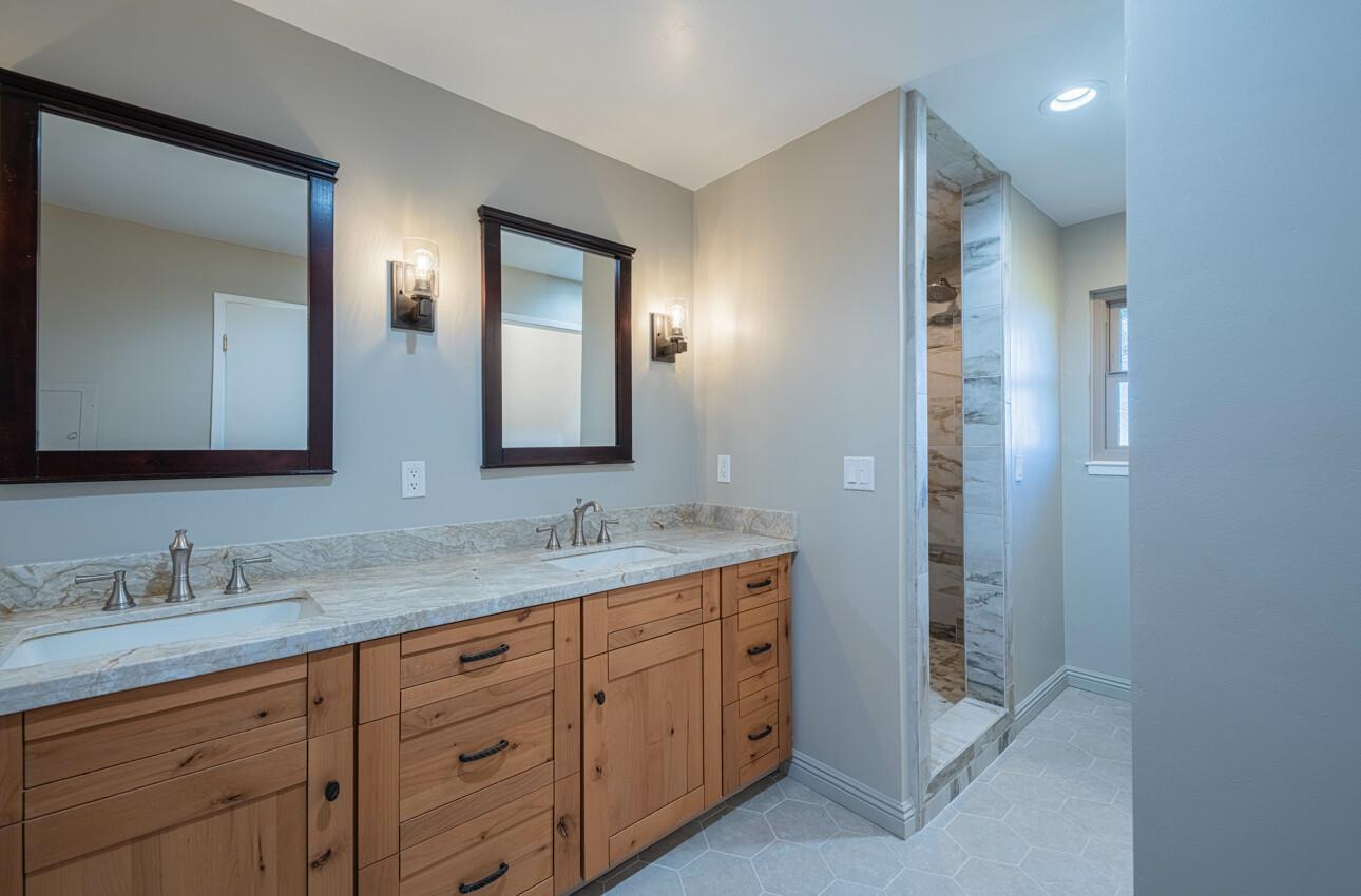 52259 Pine Canyon Road King City, CA 93930 - Photo 33 of 62 a bathroom with a granite countertop sink double and mirror