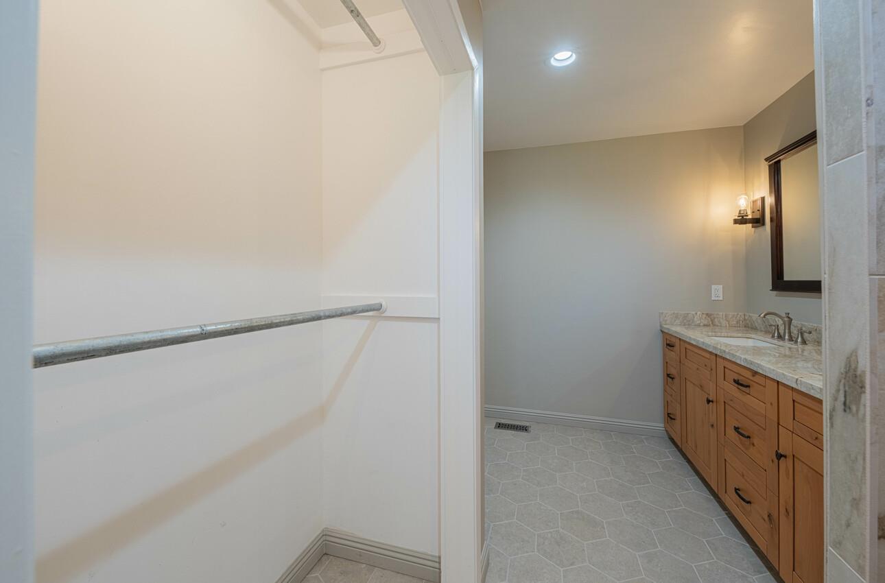 52259 Pine Canyon Road King City, CA 93930 - Photo 35 of 62 a bathroom with a double vanity sink and a mirror