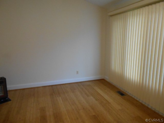 5604 Manitoba Road Chesterfield, VA 23832 - Photo 21 of 23 a view of an empty room with wooden floor and a window