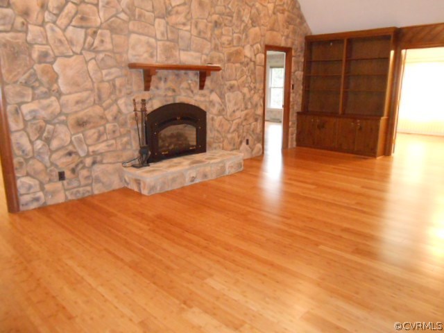 5604 Manitoba Road Chesterfield, VA 23832 - Photo 5 of 23 a view of a livingroom with wooden floor a fireplace and windows