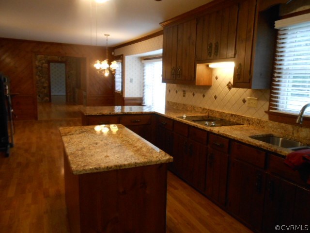 5604 Manitoba Road Chesterfield, VA 23832 - Photo 9 of 23 a kitchen with a sink and a wooden cabinets
