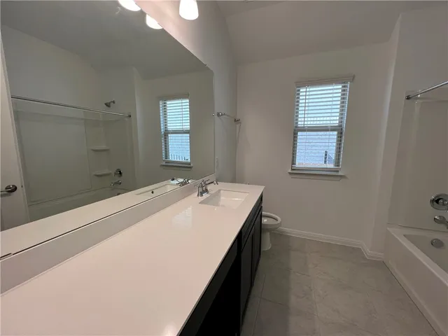a bathroom with a sink and a bathtub