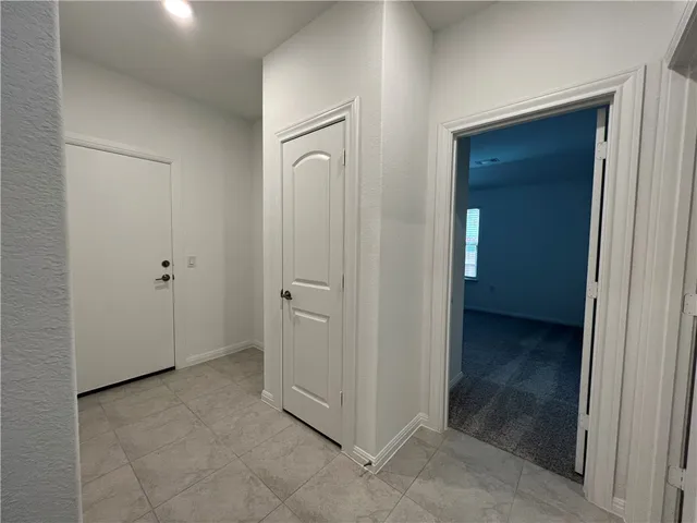 an empty room with closet area