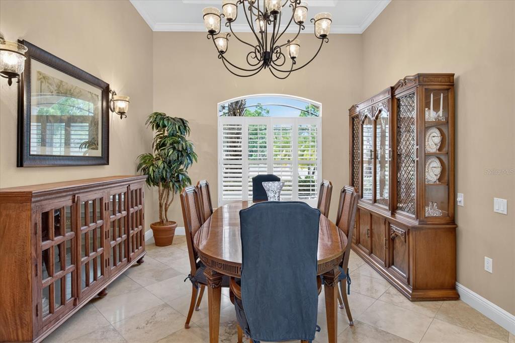 9427 Eddings Road Odessa, FL 33556 - Photo 17 of 93 a view of a dining room with furniture window and wooden floor