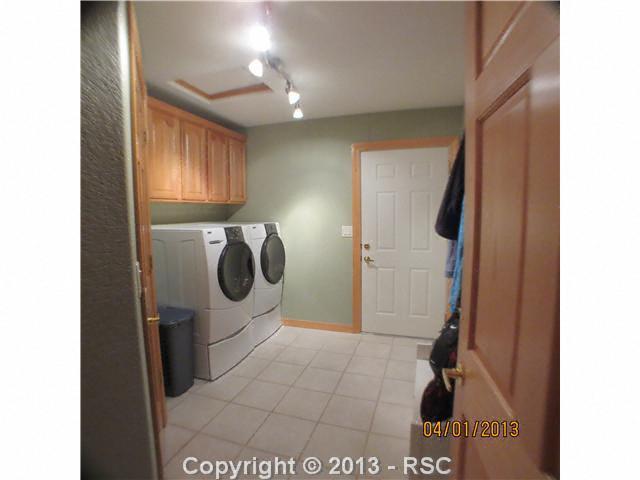 15351 Ridgefield Lane Colorado Springs, CO 80921 - Photo 14 of 15 between kitchen and garage