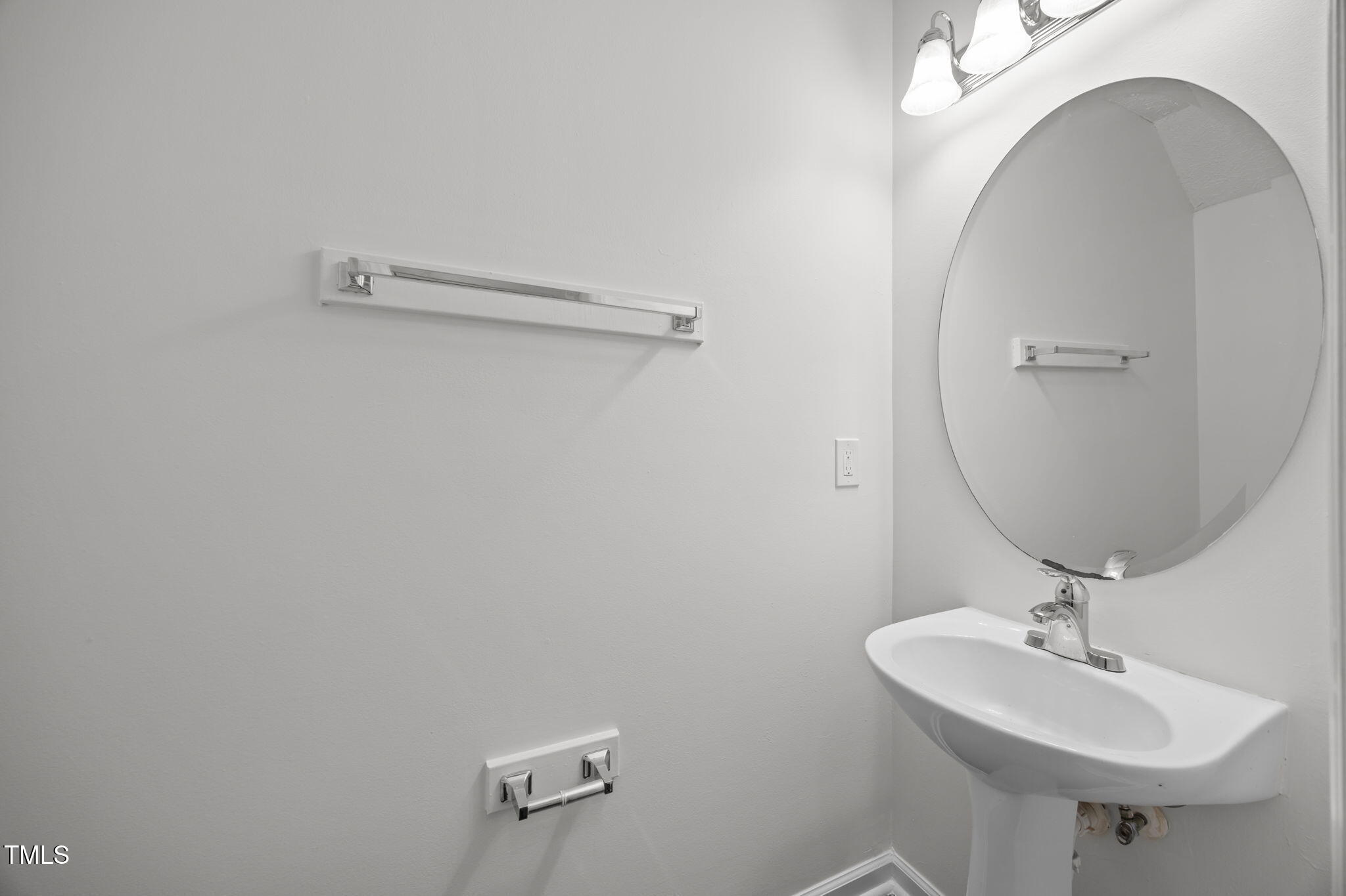 4232 Palafox Court Raleigh, NC 27604 - Photo 13 of 42 a bathroom with a sink and mirror