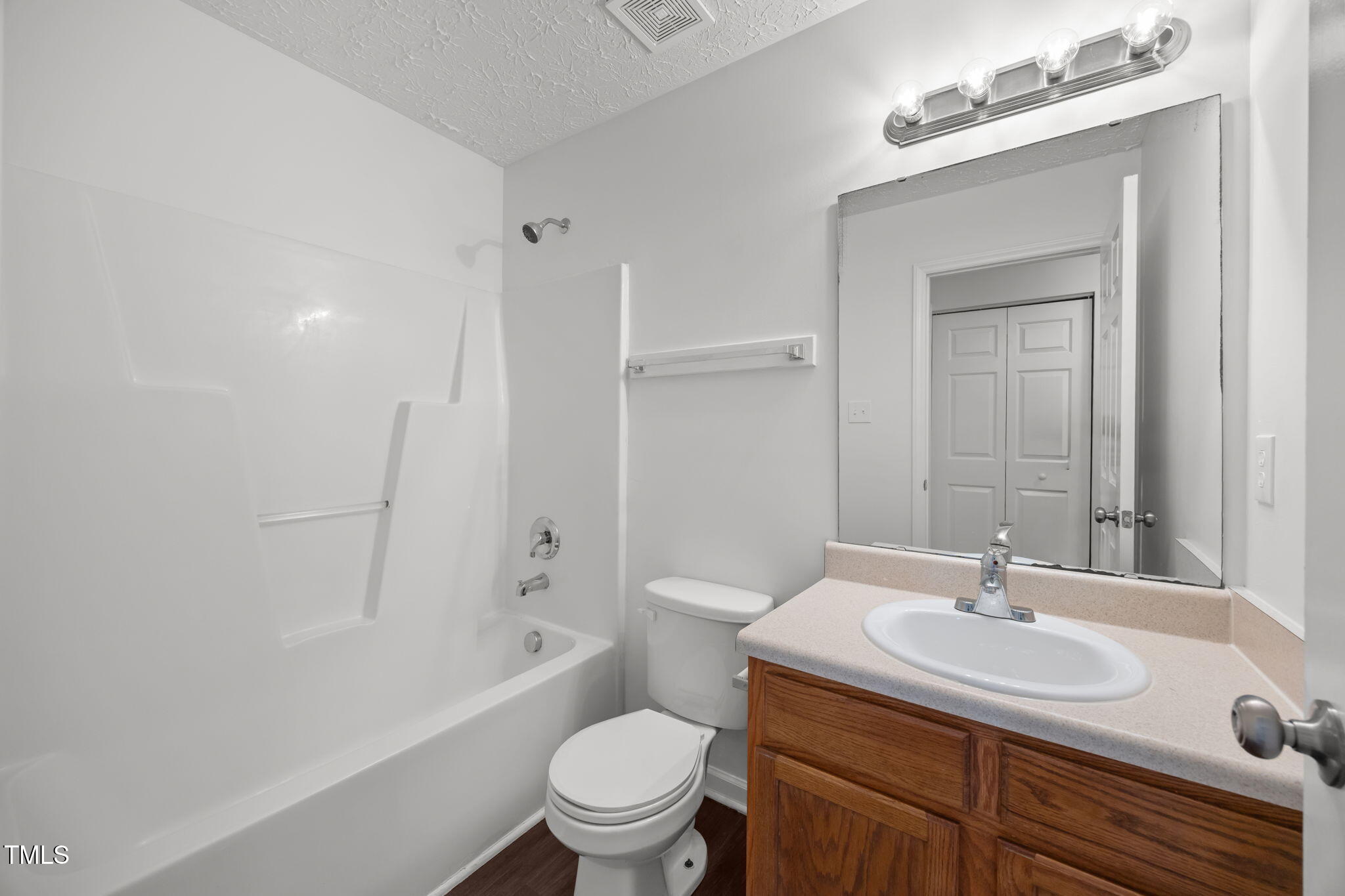 4232 Palafox Court Raleigh, NC 27604 - Photo 21 of 42 a bathroom with a sink toilet a mirror and shower