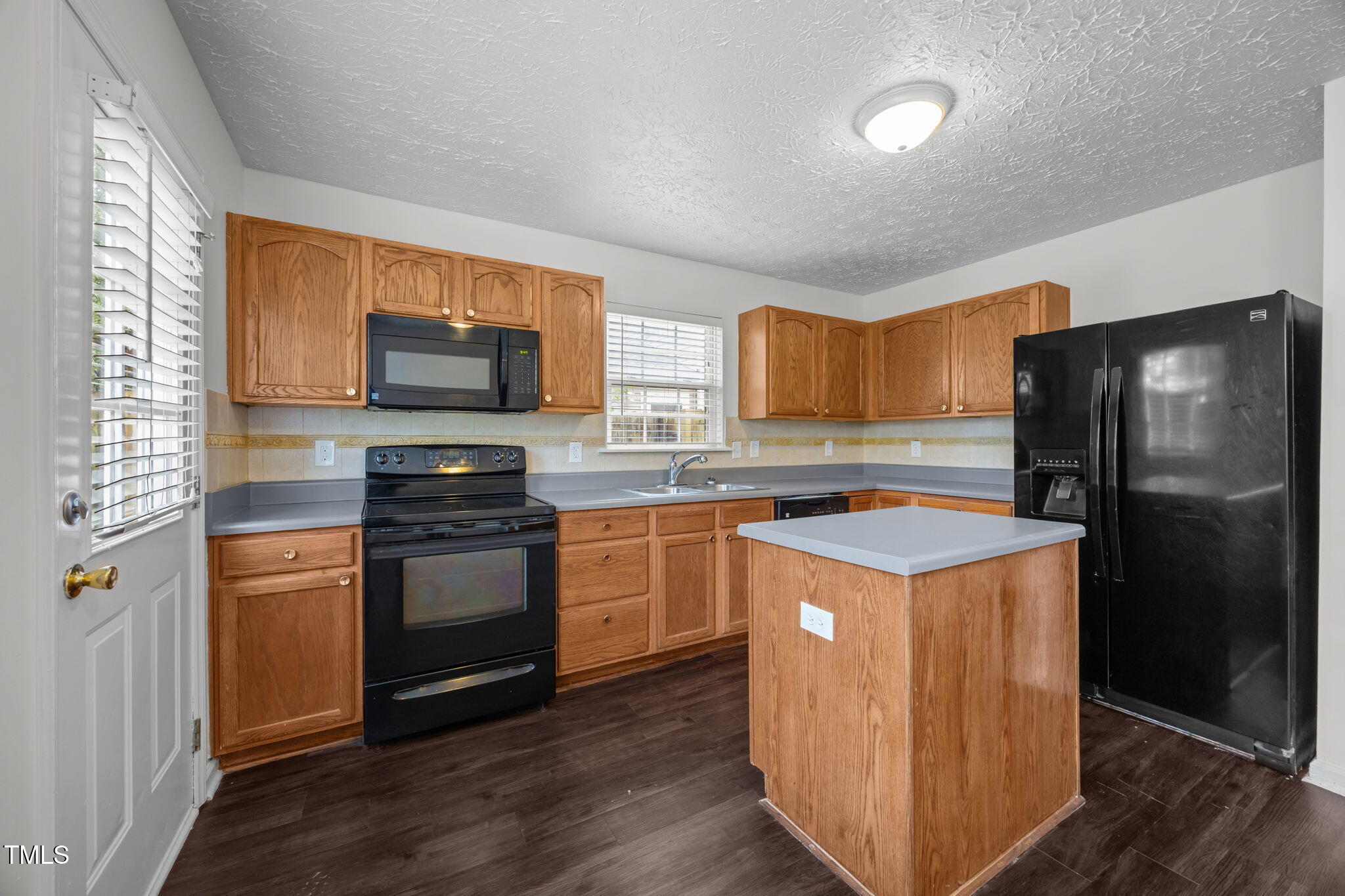 4232 Palafox Court Raleigh, NC 27604 - Photo 3 of 42 a kitchen with stainless steel appliances granite countertop a refrigerator stove and sink