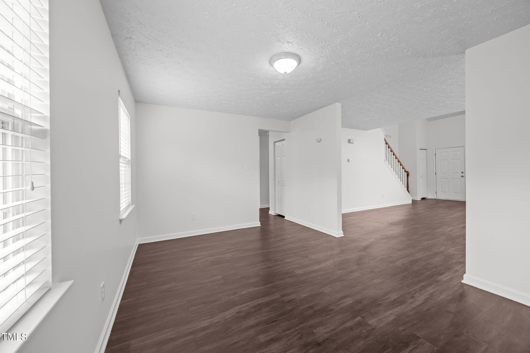 4232 Palafox Court Raleigh, NC 27604 - Photo 9 of 42 an empty room with wooden floor and windows