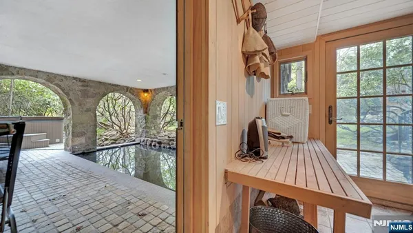 a view of swimming pool with outdoor seating