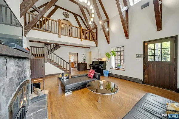 a kitchen with stainless steel appliances granite countertop a refrigerator and a stove