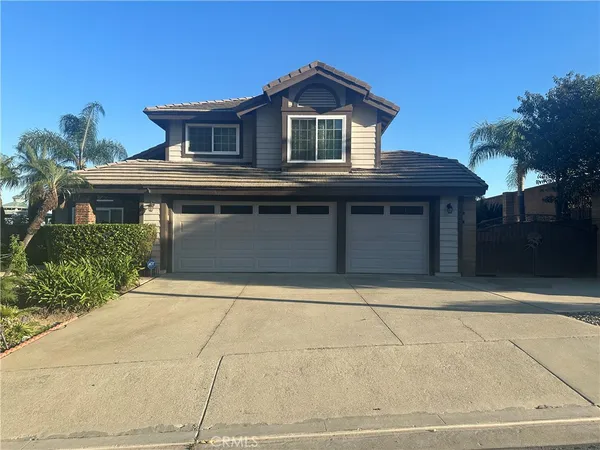 a front view of a house with a garage