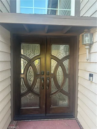 a view of door with wooden door